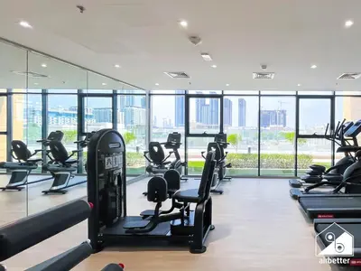 a gym with treadmills and cardio equipment in a building at Serenity Studio with Balcony at Azizi Riviera in Dubai
