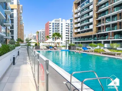 a swimming pool in the middle of a building at Modern Comfort Studio Relax & Unwind in Style in Dubai