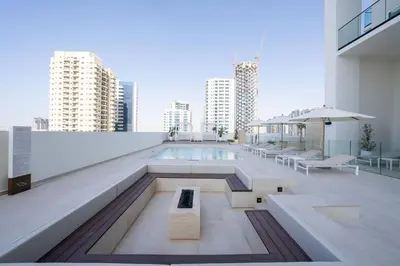 a swimming pool on the roof of a building at Citylight 1br Escape Gym, Pool And Free Parking! in Dubai
