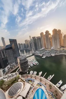 a view of a city with boats in the water at Luxury in Dubai Marina Dining Pool Day & Beaches in Dubai