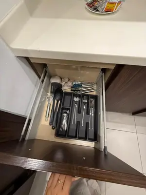 a drawer with utensils in a cabinet at Unreal Patio Private beach Sea View 1BR in Dubai