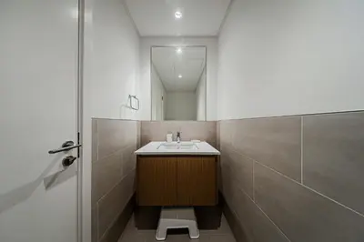 a bathroom with a sink and a mirror at Spacious 3BD apartment at Creek Beach, Dubai in Dubai