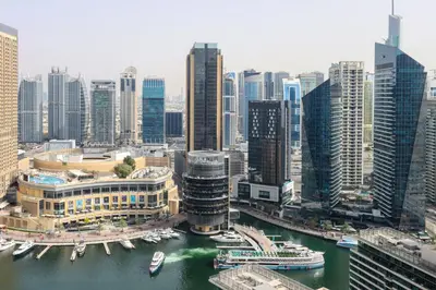 an aerial view of a city with boats in the water at Upgraded 1BHK with Stunning Marina Views in Dubai