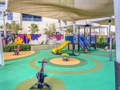 a playground with a slide and slides at High-Floor Skyline View Near Safa Park and Godolphin Stables with Easy Access to Dubai Mall and Canal, Aykon City 2 Tower C, Business Bay by Deluxe Holiday Homes in Dubai