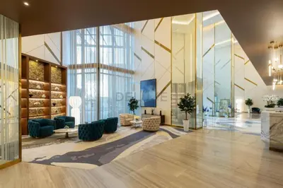 a lobby of a building with a large glass wall at High-Floor Skyline View Near Safa Park and Godolphin Stables with Easy Access to Dubai Mall and Canal, Aykon City 2 Tower C, Business Bay by Deluxe Holiday Homes in Dubai