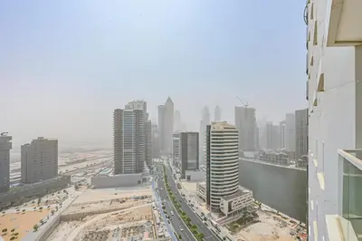 a view of a city skyline with tall buildings at Enjoy Modern Comforts with Views of Burj Al Aráb and Nearby Attractions in Dubai