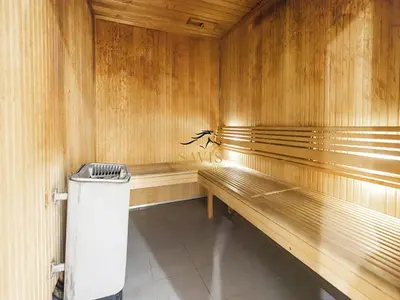 a sauna with wooden benches and a trash can at Savis Homes - The Voleo - Bright and elegant studio - Business Bay in Dubai in Dubai