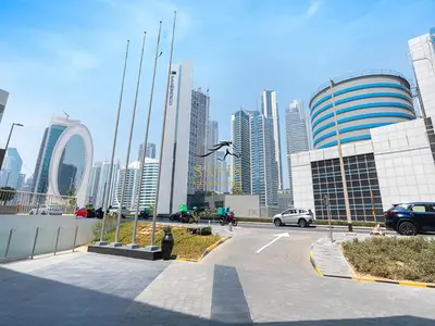 a parking lot in a large city with tall buildings at Savis Homes - The Voleo - Bright and elegant studio - Business Bay in Dubai in Dubai