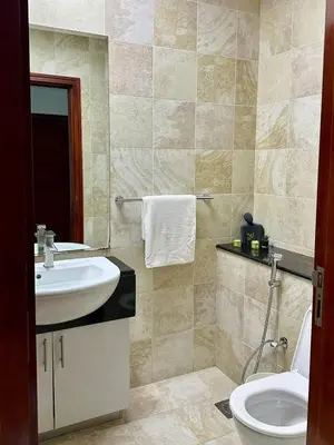 a bathroom with a sink and a toilet at Luxury 2 BR Apartment Marina View in Dubai