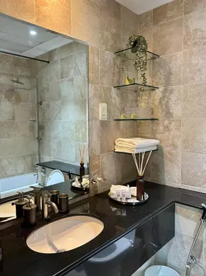 a bathroom with a sink and a shower at Luxury 2 BR Apartment Marina View in Dubai
