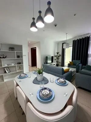 a living room with a white table and chairs at Luxury 2 BR Apartment Marina View in Dubai
