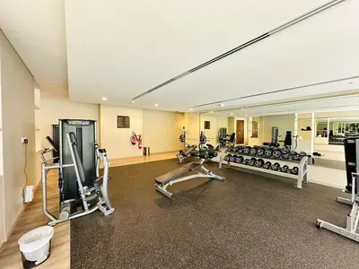 a gym with several treadmills and exercise bikes at Elite & Classy Furnished and Exquisite Living Room in Dubai