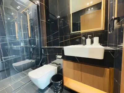 a bathroom with a sink and a toilet at Brand New with Installed Private Pool in Balcony in Dubai