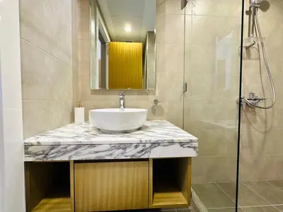a bathroom with a sink and a shower at Cozy Haven High Rise Balcony and Upscale Furnished in Dubai