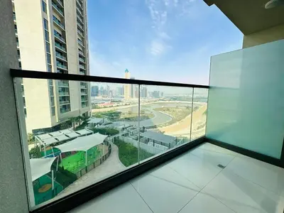 a balcony with a view of a city from a building at Sleek Charm Inviting Atmosphere and Cozy Balcony in Dubai