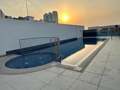 a swimming pool on the roof of a building at Stay Inn AlBarsha by PHM in Sabkhah