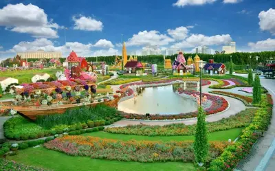 a garden in the theme park at Modern & Stylish 1BR, Pool & Gym in Dubai