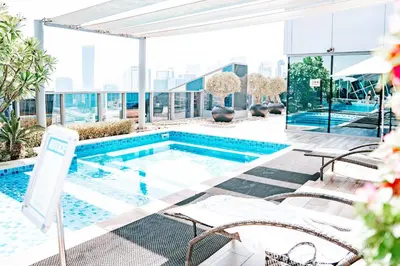 a swimming pool on the roof of a building at Chic Business Bay Retreat l Pool, Luxury Amenities in Dubai