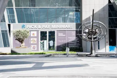 a building with a sign that reads pick pay min implement at Chic Business Bay Retreat l Pool, Luxury Amenities in Dubai
