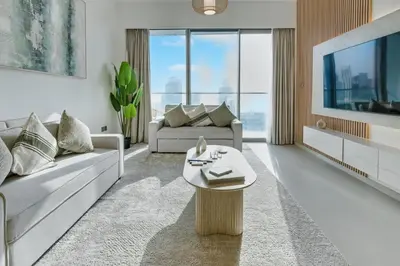 a living room with a couch and a table at Downtown Luxury - 4 Minutes Walk to Dubai Mall & Burj Khalifa in Dubai