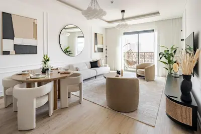 a living room with a table and chairs and a couch at Central Park Building, City Walk - 1BR Sophisticated Apartment in Dubai