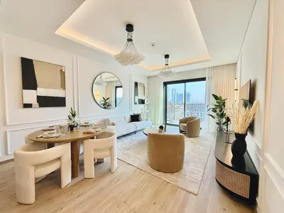 a living room with a table and chairs and a couch at Central Park Building, City Walk - 1BR Sophisticated Apartment in Dubai
