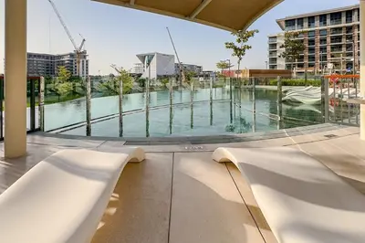 a view of a swimming pool from a building at Central Park Building, City Walk - 1BR Sophisticated Apartment in Dubai