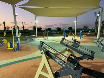 a park with a playground with a canopy at Elegant 3BR Villa with Access to Pool & Gym in Dubai
