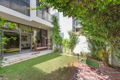 an exterior view of a building with a yard at Elegant 3BR Villa with Access to Pool & Gym in Dubai