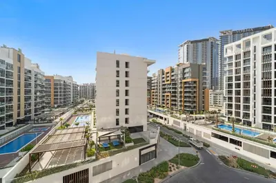 a view of a city with tall buildings at Charming Studio with Pool, Gym, Kid's playground in Dubai