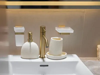 a bathroom sink with a faucet and toilet paper at Daniels Studio with Private Jacuzzi & Canal View in Dubai