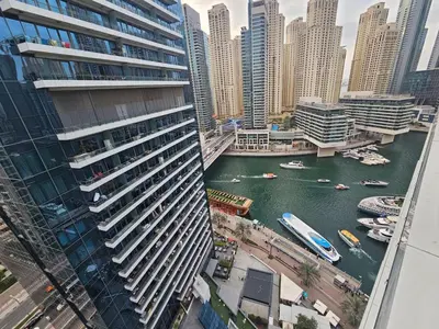 a view of a river in a city with buildings at Dubai Silverene Tower with large balcony and high floor Marina views in Dubai