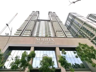 a tall building with a sign on top of it at STAY BY LATINEM Luxury 1BR Holiday Home CVR A1814 near Burj Khalifa in Dubai