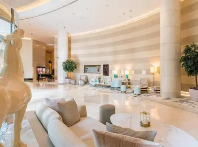 a lobby of a hotel with a statue of a woman at Amazing Dubai Marina Studio Pool Beach Sea View in Dubai