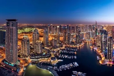 an aerial view of a city at night at Amazing Dubai Marina Studio Pool Beach Sea View in Dubai