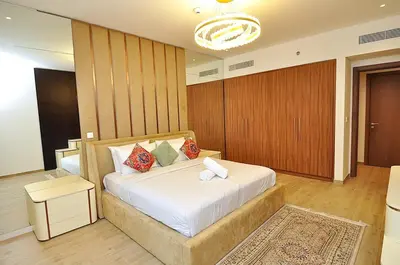 a bedroom with a large bed in a room at Luxury 1 Bedroom Burj Khalifa View Citywalk in Dubai