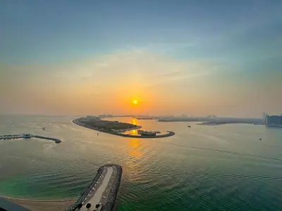 an aerial view of a river at sunset at Luxury 2BR in Beach Vista With Stunning Palm Views in Dubai