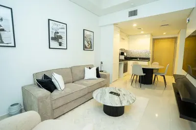 a living room with a couch and a table at High-Floor 2BR - Aykon City 2BR in Business Bay in Dubai