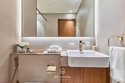 a bathroom with a sink and a mirror at Binghatti Gardenia 1BR - Near Parks and Mall JVC in Dubai