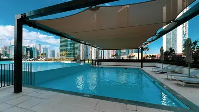 a swimming pool on the roof of a building at Exceptional 2 Bedroom Apartment! High Floor! Amazing Rooftop! Burj Crown by Emaar in Dubai