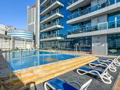 a pool in a building with chairs and a bench at Bookable - Penthouse 5,000sqft by Downtown Dubai in Dubai