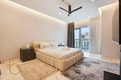 a bedroom with a large bed and a ceiling fan at Bookable - Penthouse 5,000sqft by Downtown Dubai in Dubai