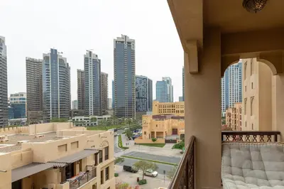 a view of a city from a balcony with buildings at Oasis in the heart of Downtown in Dubai
