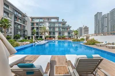an image of a swimming pool at a building at Waves - Modern JVC Studio with Balcony in Dubai