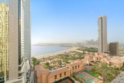a view of a beach from a building at JBR 3BR Palm Jumeirah & Sea Views, Pool & Gym Access in Dubai