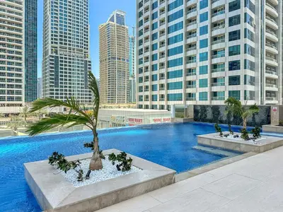 a swimming pool in a city with tall buildings at Modern 3BR with City Views and a Spacious Layout in Dubai
