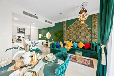 a living room with a couch and a table at 1BR Full Burj View 1 min to Dubai Mall Arabic Vibe in Dubai