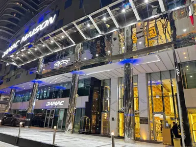 a store front of a shopping mall at night at 1BR Full Burj View 1 min to Dubai Mall Arabic Vibe in Dubai