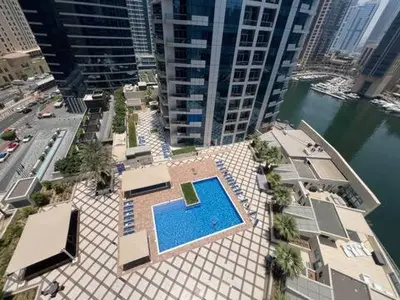 an overhead view of a swimming pool in a city at Cozy Marina Studio, Canal View with a Balcony in Dubai