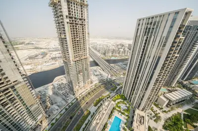an aerial view of a city with tall buildings at Luxurious 1BR Apartment in Harbour Gate in Dubai